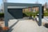 Carport with gravel parking space