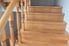 unpainted wooden stairs and railing