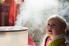Young girl sitting in front of humidifier