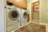 A laundry room with a washer and dryer side-by-side.