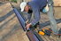 Man installing a roof ridge vent