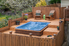 a hot tub with surrounding deck
