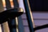 close-up of wooden rocking chair painted black