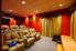 A home theater with large, leather chairs.