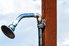 outdoor shower head mounted to a post
