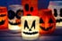 lighted halloween mason jars with colorful tissue and cutout shapes