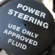 The cap to the power steering fluid reservoir.