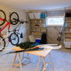 basement with bikes, skis, and a window