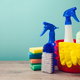 A grouping of cleaning products including a bucket and spray bottle.