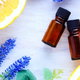 essential oils with lemons, oranges, and lavender flowers