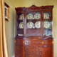 China hutch in the corner of a room