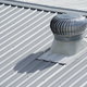 A roof vent on a metal roof.
