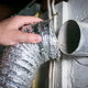 attaching a dryer hose to the vent