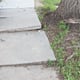 dangerous uneven concrete sidewalk