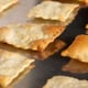 homemade crackers baking on a metal sheet