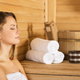 Woman sitting in a sauna