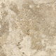 A close-up of the texture of travertine tile.