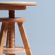 adjustable bar stool with large screw thread in the middle