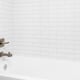 white ceramic tile surround around a bathtub and shower