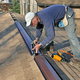 Man installing a roof ridge vent