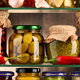 food goods in jars on a glass shelf