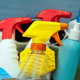 various cleaning supplies in a bucket