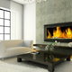 A modern living room with a large gas fireplace.