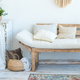 relaxing rustic design including wooden couch with covered cushions