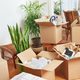 moving boxes with things piled into them
