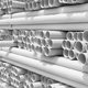 PVC pipes stacked in rows.