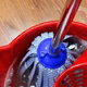 a mop in a bucket on a vinyl floor
