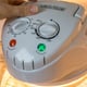 hand using halogen oven cooking device