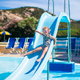 A child going down a pool slide.
