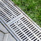 drainage gutter between flagstones and lawn