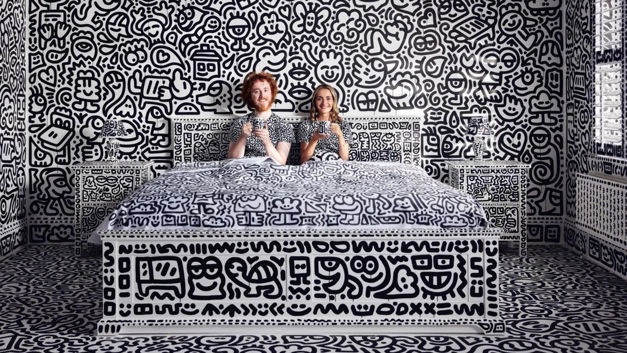 Sam and Alena Cox (aka Mr. and Mrs. Doodle) sip coffee from doodle-covered mugs in the doodle-covered bedroom of their doodle-covered mansion in Kent, England. 
