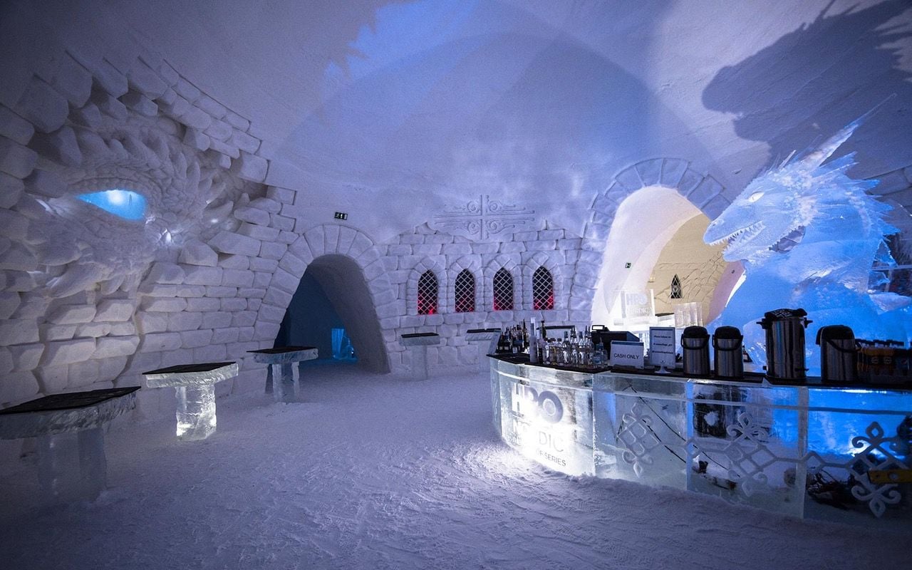 Icy dragons dance around the bar in Lapland Hotels SnowVillage 