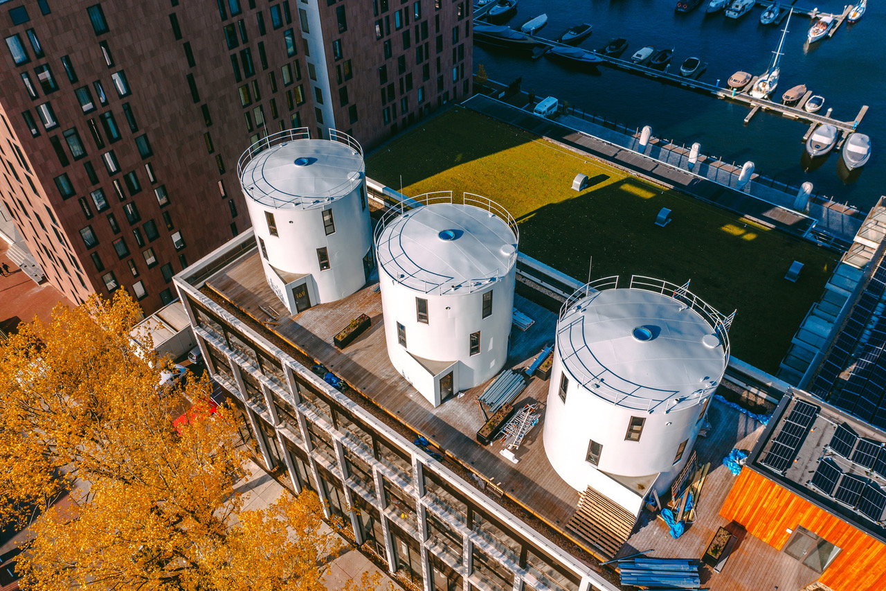 Three Converted Wine Silos Add Living Space to a Waterfront Rooftop in Amsterdam