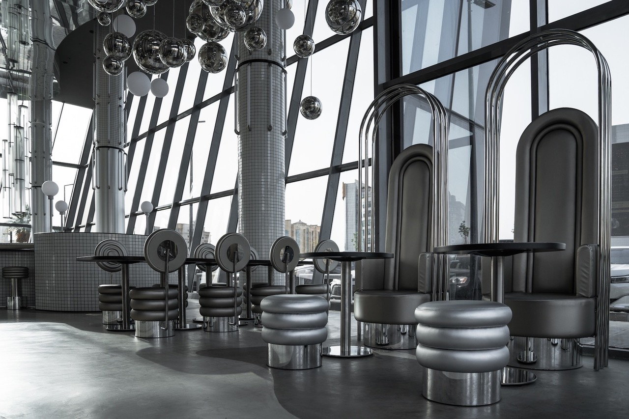 Silver, retrofuturistic interiors of the Masquespacio-designed MO Bakery in Saudi Arabia. 