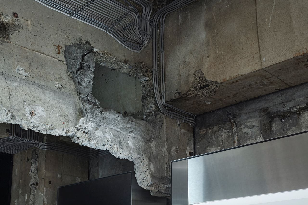 Worn concrete details add a sense of history to the new ASKWATCH store. 