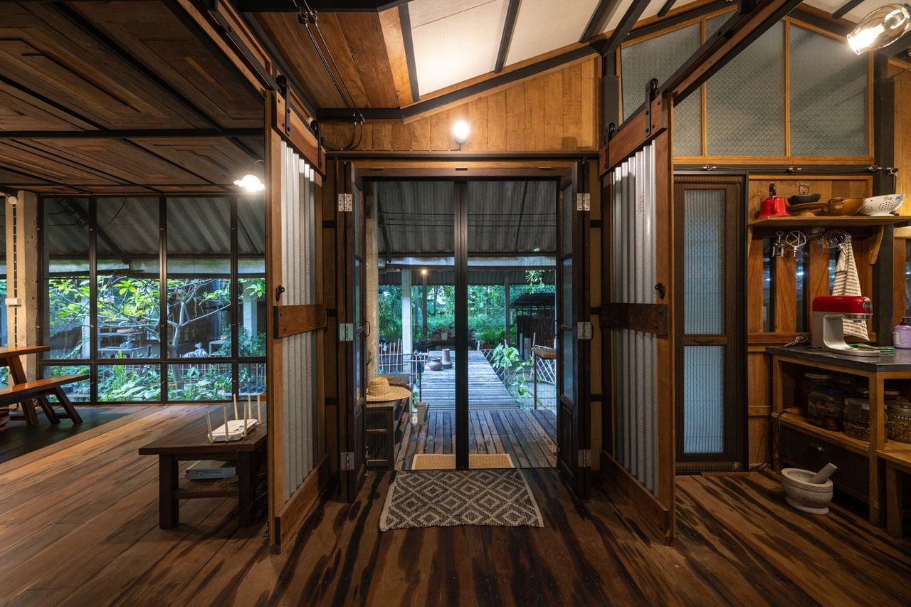 Reclaimed wooden interiors of the Kha-Nam Noi house have a lovely homey feel to them.
