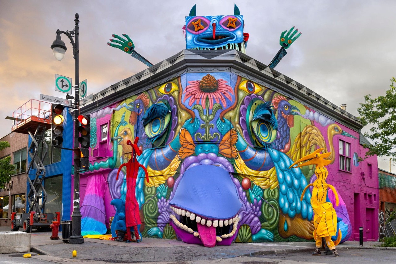 Gigantic puppet mural on the facade of a Montreal store by French-Canadian artist Danaé Brissonet. 