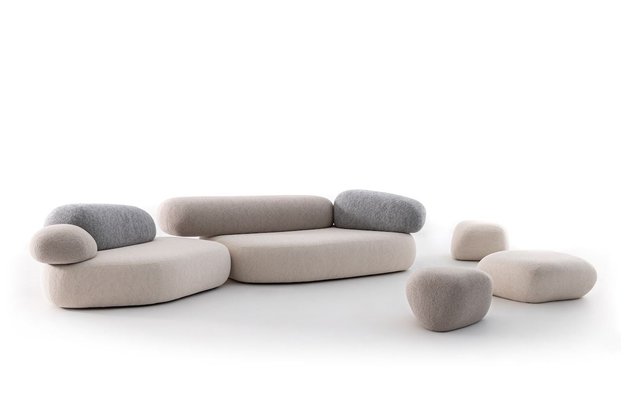 Nature-inspired sofa from Pebble Rubble resembles a small stack of long, gray boulders. 
