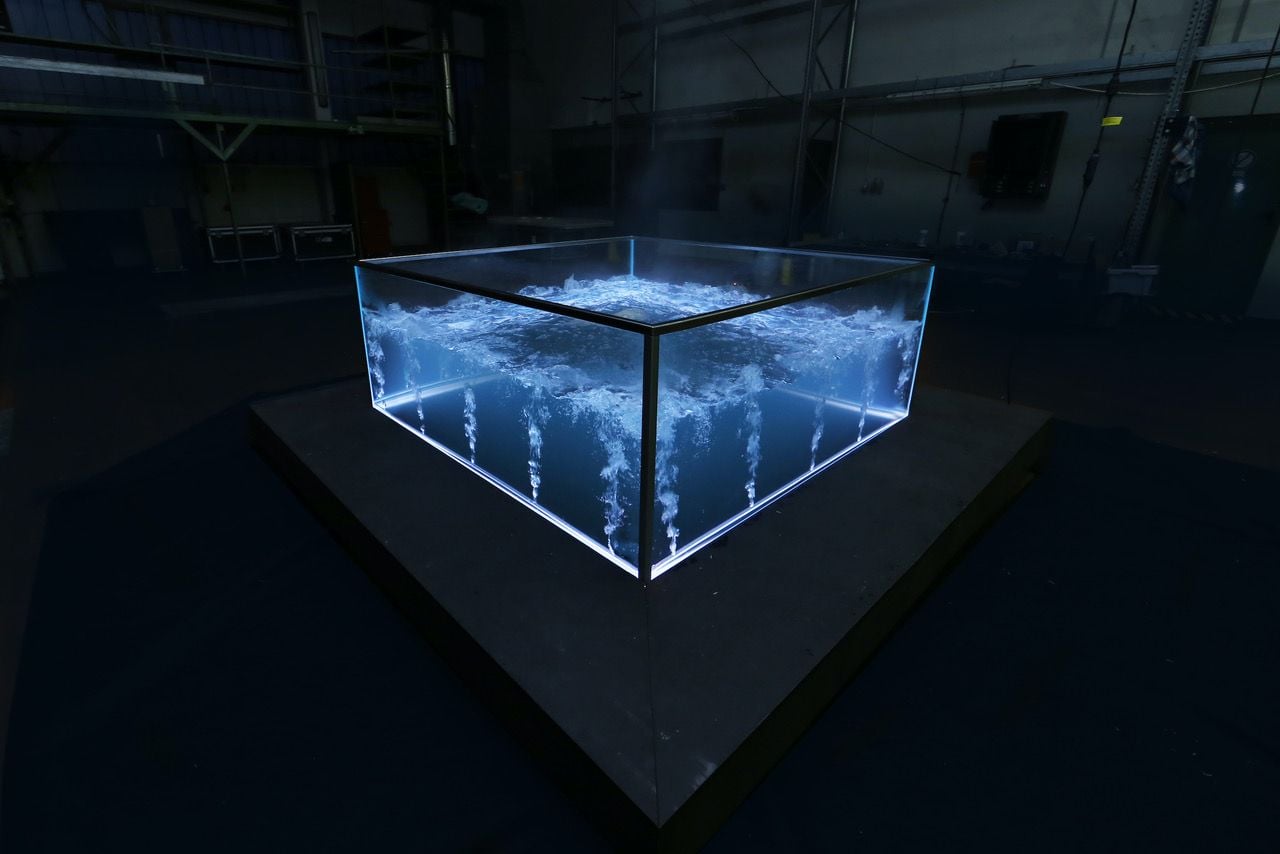 The all-glass Nautilus MK I glass hot tub emits a futuristic glow in the dark.