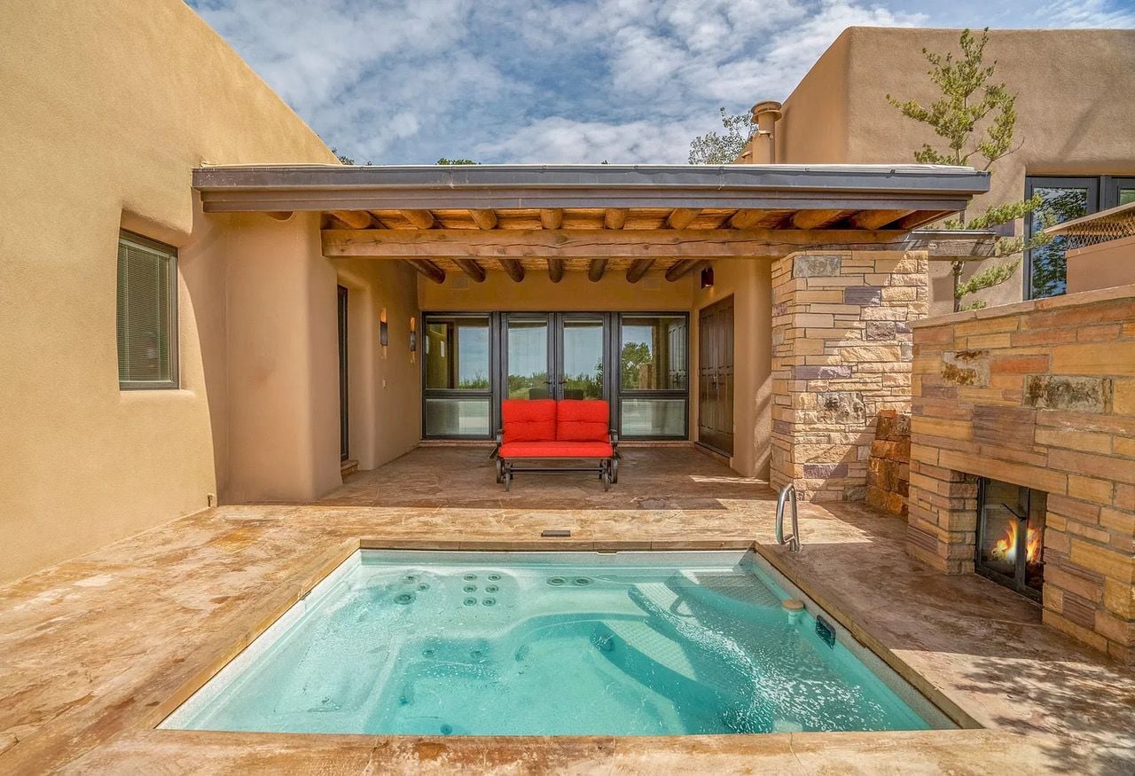 In-ground outdoor hot tub at Santa Fe's 1432 Old Sunset Trail.