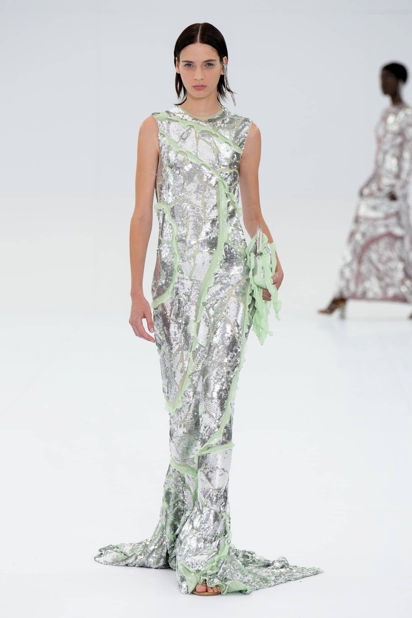 Fendi model sports a metallic dress for July's Paris Fashion Week 2022.