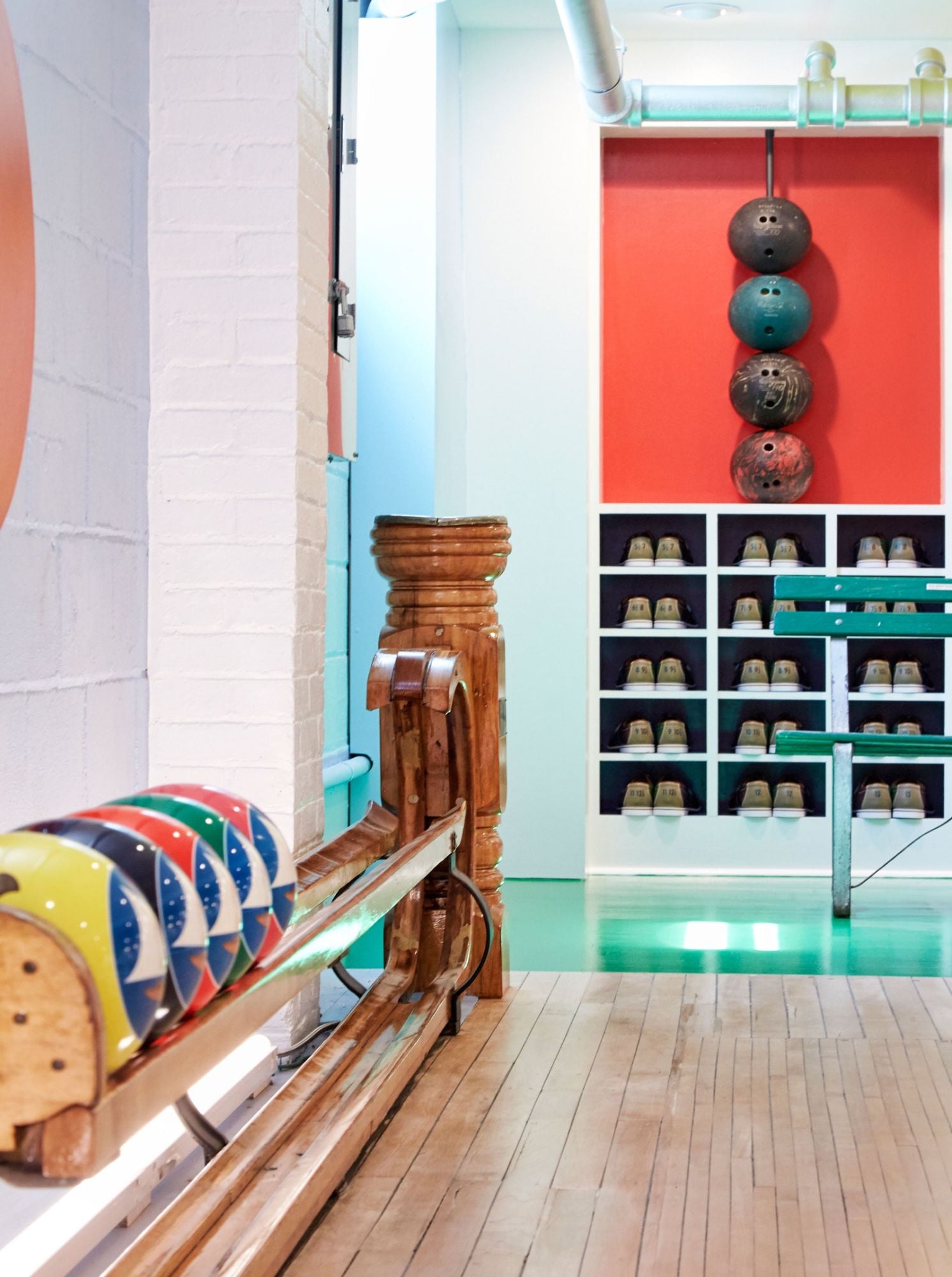 Colorful bowling balls and sleek wooden rails grace the lanes of the renovated Bellport Bowling Alley.