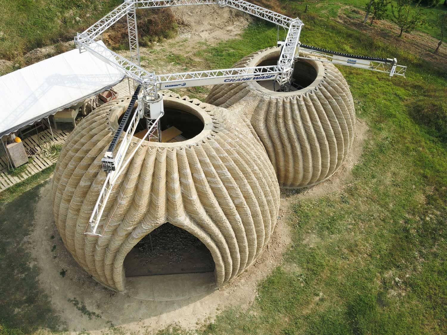 WASP Crane 3D Printers construct the TECLA dome house.