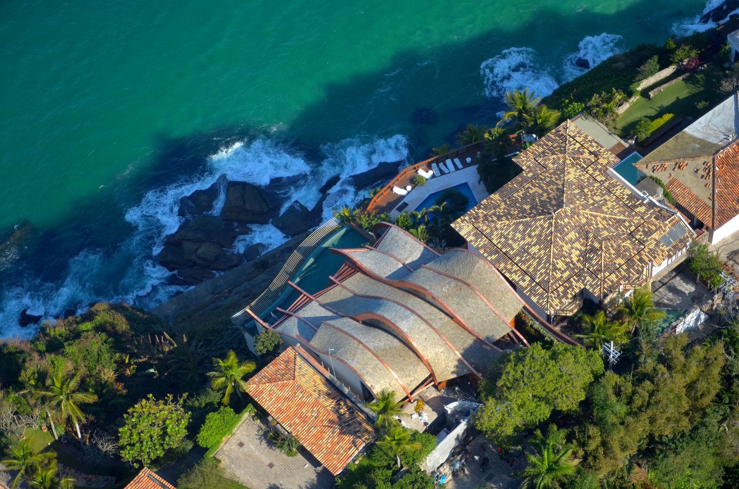 Aerial view of the Wave House's flowing sculptural roof 