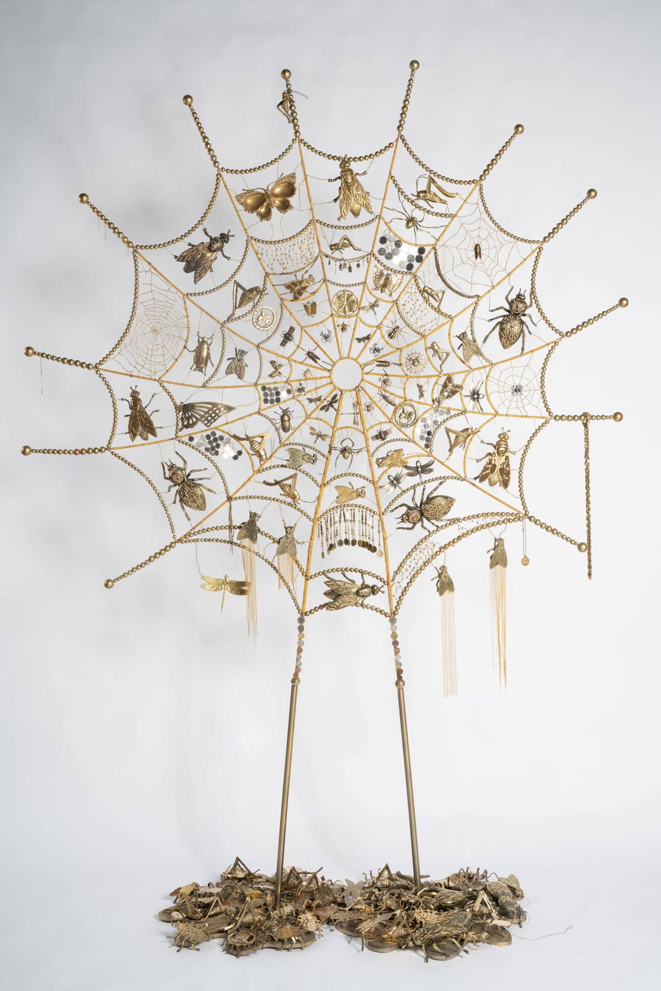 Golden spider web by Ann Carrington. 