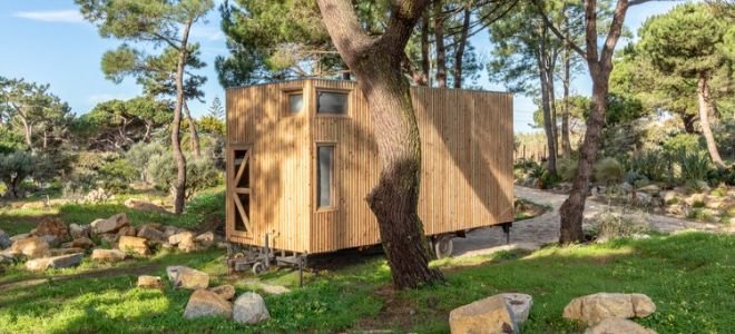 small off grid tiny home with wood siding